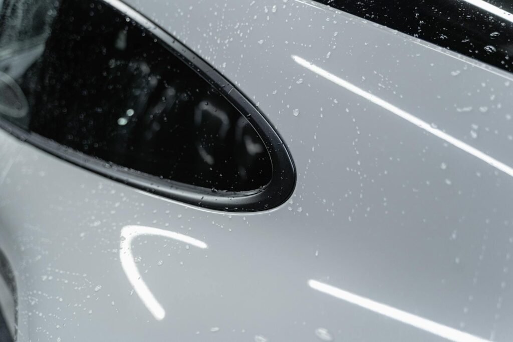 Water Droplets on a White Car